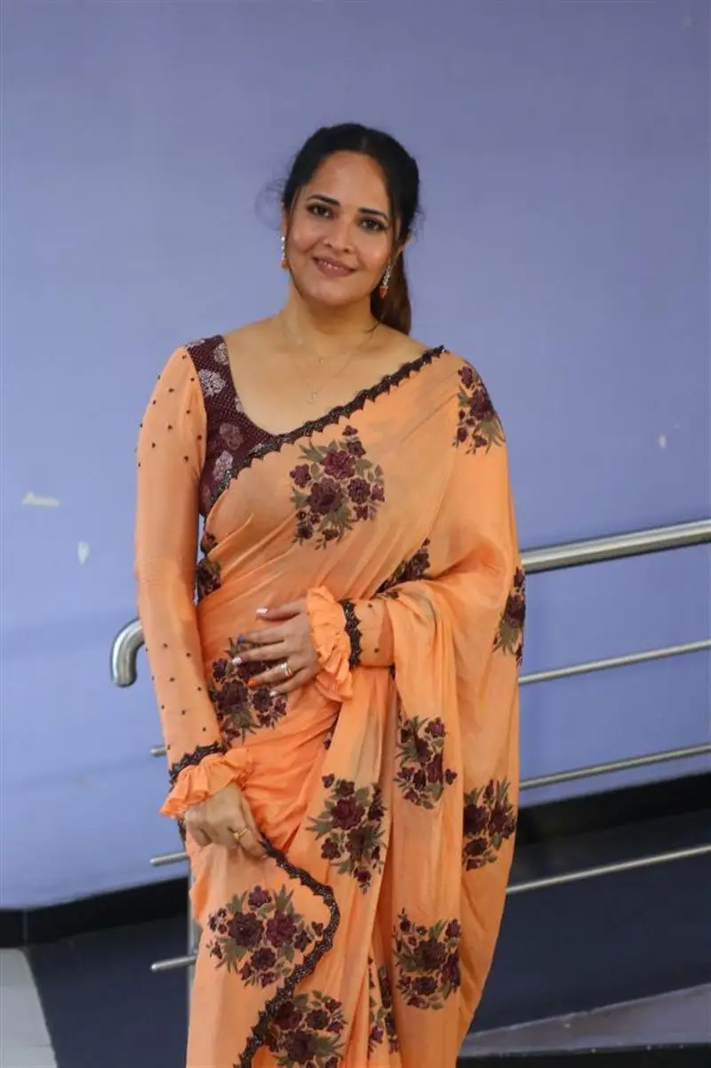 Telugu Actress Anasuya Bharadwaj In Beautiful Orange Saree